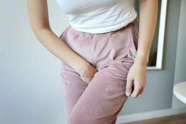 woman running for the toilet because of urinary incontinence Luton